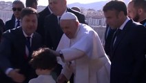 Pope Francis blesses children on visit to Marseille as French President Emmanuel Macron watches on