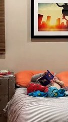 Big Brother Lovingly Pretends To Read To Sister