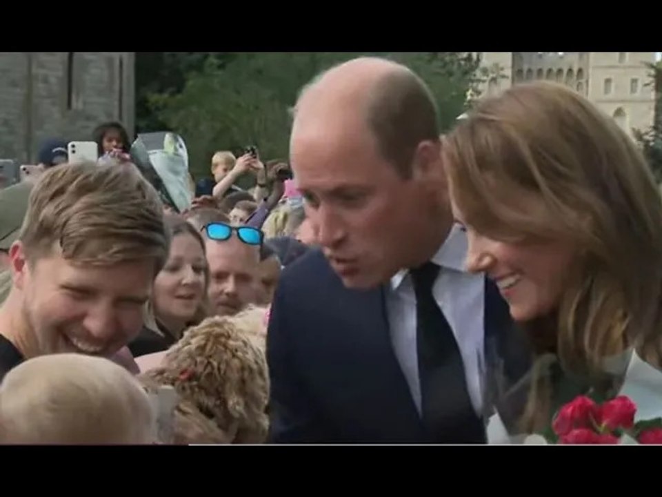 Prince William adorably pulls faces at baby in crowds watched by Kate