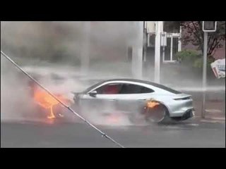 Download Video: £200k Porsche EV bursts into flames on street during rush hour as firefighters battle blaze