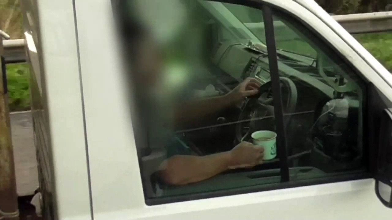 Driver caught sipping mug of tea and removing both hands from wheel by police