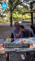Watch: Bear crashes family picnic in viral video; mother shields son as animal enjoys their food