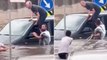 Yağışın etkili olduğu İkitelli'de aracında mahsur kalan sürücü, direğe bağlanan halat yardımıyla kurtarıldı