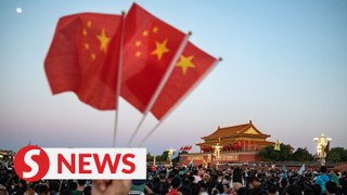 Thousands flock to Tian’anmen Square to watch grand flag raising ceremony on National Day