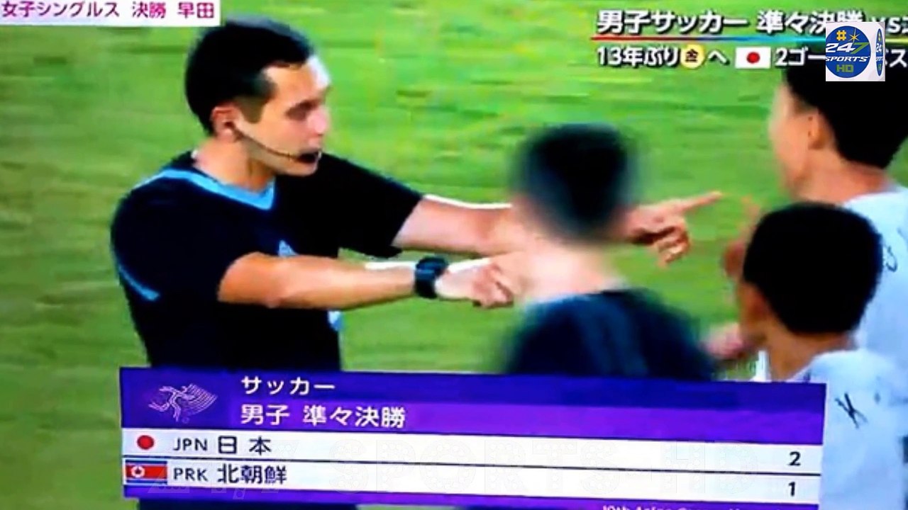 North Korean players ATTACK the referee after their 2-1 defeat by Japan in Asian Games quarter finals, with the official surrounded and shoved in heated scenes