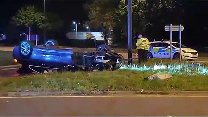 Watch police response after car flips over on Crawley roundabout
