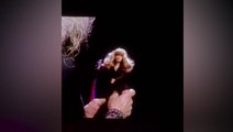 Stevie Nicks plays with her own Barbie doll on stage during New York Madison Square Gardens concert