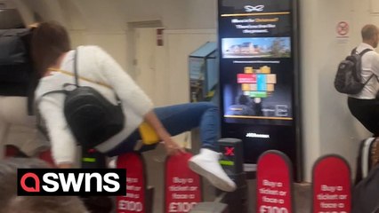 Moment commuters jumped barriers to try and catch train as strikes hit Britain