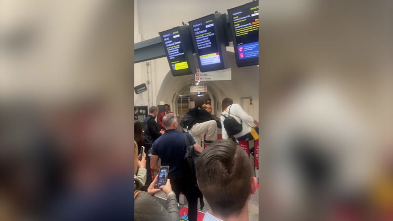 Commuters jump barriers to try and catch train as rail strikes hit UK