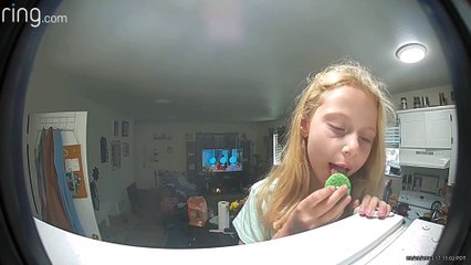 Girl Sneaks a Cookie Without Mom’s Permission