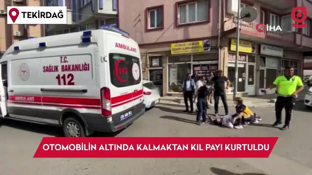 Otomobilin altında kalmaktan kıl payı kurtuldu: O anlar kameraya yansıdı