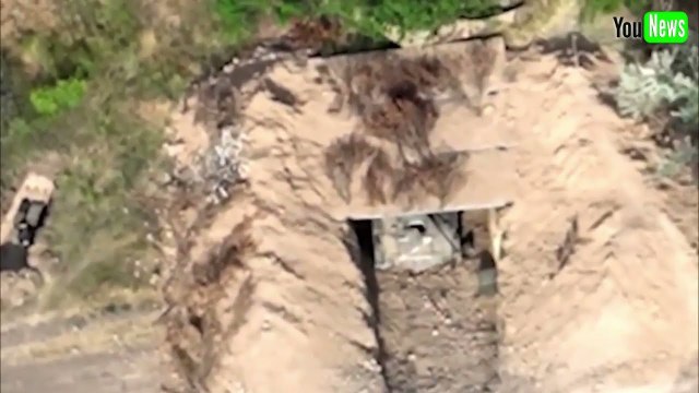 Ukrainian forces target a Russian line of trenches and camouflaged dugouts
