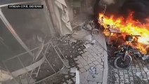 عناصر الخوذ البيضاء يجرون عمليات إنقاذ في جسر الشغور بعد قصف لقوات النظام