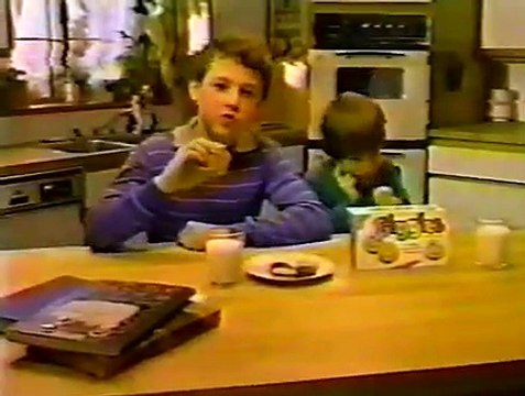 Giggles Cookies - Two kinds of creme in each funny face - Advert