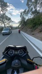 Motorcycle Follows Wheelchair Down Hill