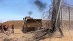 Palestinians tear down the fence separating Gaza from Israel with a bulldozer