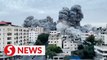 Gaza buildings collapse after Israeli air strike