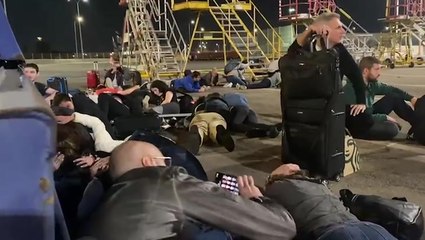 Plane passengers duck for cover at Tel Aviv airport as missile sirens echo