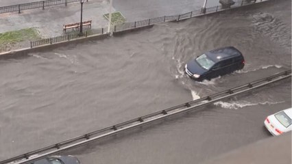 A capture of the cars navigate through a flooded section of the FDR in Manhattan