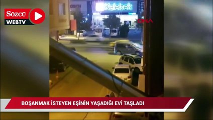Boşanmak isteyen eşinin evini taşladı