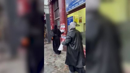 Footage shows two women in London tearing down posters of missing Israeli children