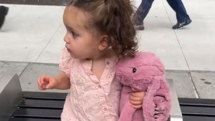 Precious girl and her bunny best friend wait for 'big bus' to take them to museum