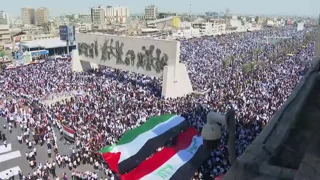 Miles de personas se manifiestan en Irak quemando banderas de Israel