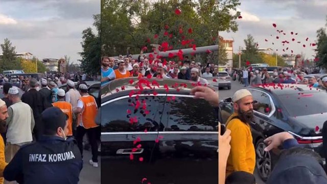 Devletin memuru Menzil şeyhinin ultra lüks aracına güller attı