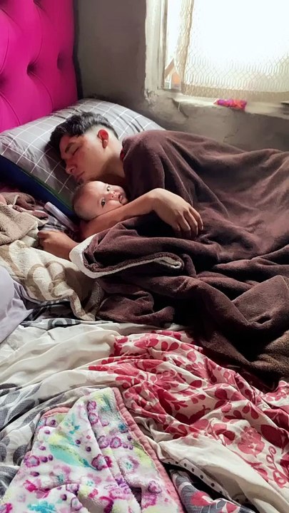 Sleeping Dad Cuddles Infant Daughter