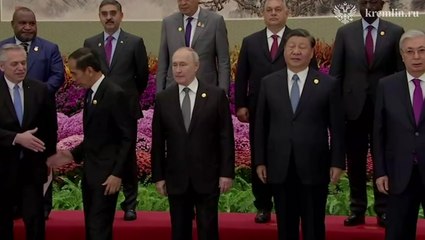 Putin and Xi Jinping pose for photos as world leaders gather in China