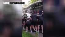 The incredible moment the All Blacks lift a car blocking their team bus