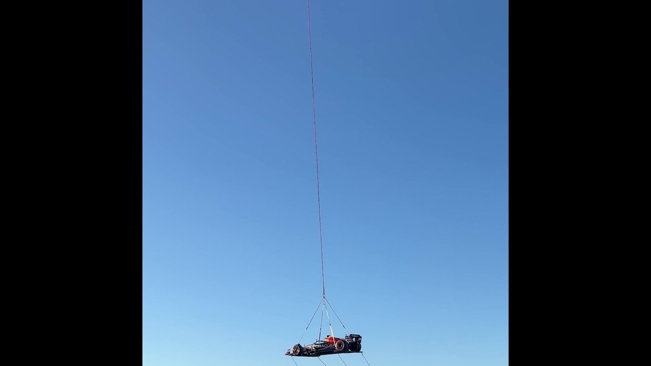 Red Bull reveals Texas-inspired livery for US GP flying car over Austin attached to a helicopter