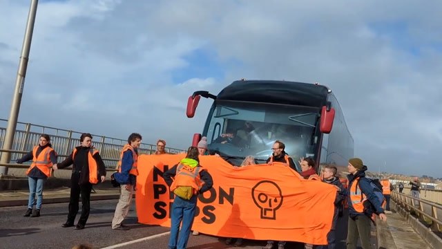 Just Stop Oil block coach taking refugees to Bibby Stockholm barge