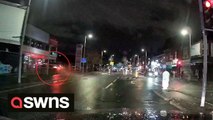 Moment car speeds through T-junction and smashes into building
