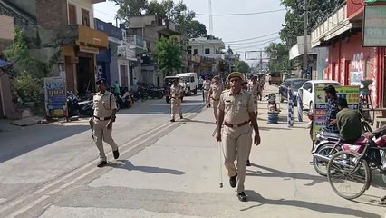 CRPF and police personnel took out flag march.