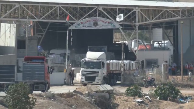 Watch: Trucks pass through Rafah border as crossing opens to allow aid into Gaza