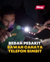 Bedah pesakit  bawah cahaya telefon bimbit