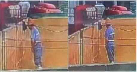 Trabajador de fábrica de cerveza orina en contenedor de líquido