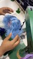 Doll Gets Blue Hair Sewn On