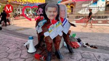 Migrantes queman piñatas de presidentes en protesta durante la cumbre de Palenque