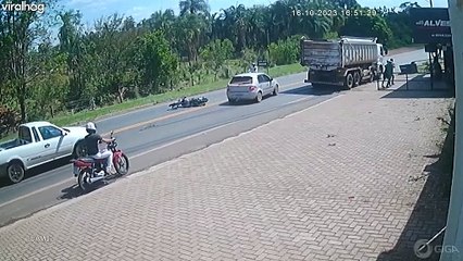 Motorcyclist Wheelies Into Oncoming Truck