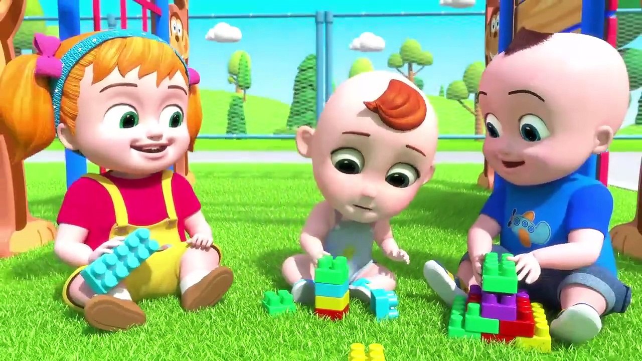Johnny and babies Playing and learning in the Park with building blocks ...