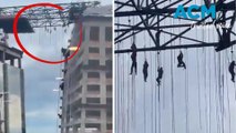 Workers left hanging 500ft in air after scaffolding collapses
