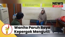 wanita paruh baya kepergok mengutil