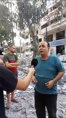 منير رضوان يتحدث من أمام برج فلسطين بعد قصفه