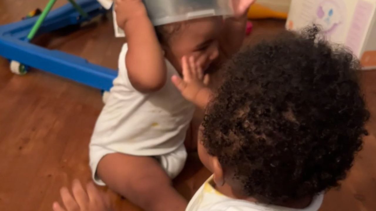 Mischievous boy sticks finger in twin's mouth, gets bite-sized life lesson