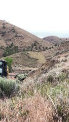 Construction Workers Demolish A Hilltop