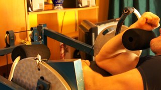 Michael Gundill performs super slow biceps curls on a Nautilus machine