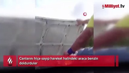 Canlarını hiçe sayıp hareket halindeki araca benzin doldurdular