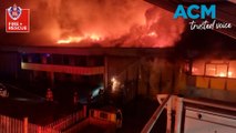 Massive fire engulfs warehouse in Girraween, NSW